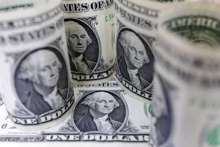 Dollar steady as traders await clues on US rate path By Reuters