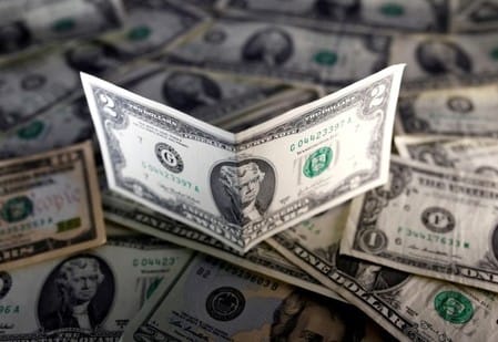 Dollar calm as traders await clues on US rate path