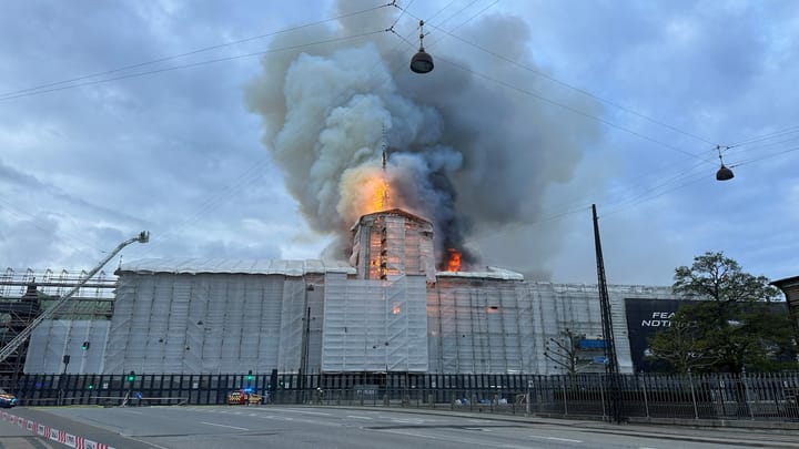 Fire rips through Old Stock Exchange building in Copenhagen as people try to rescue artwork