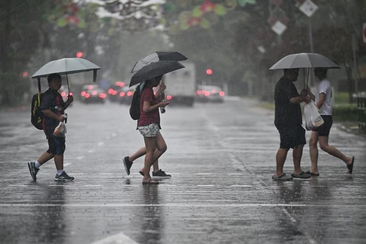 Heavy rain prompts flood warnings for many areas of Singapore